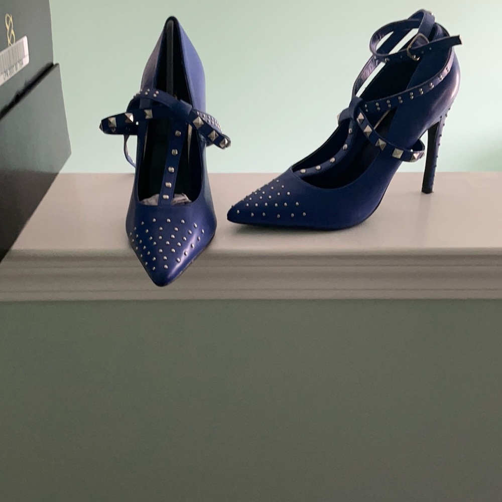 These are beautiful blue shoes with silver accents.